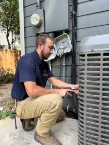 Cool Dynamics tech fixing an AC unit