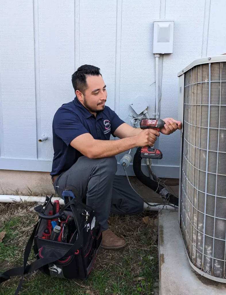 Nathaniel Segura working on an AC